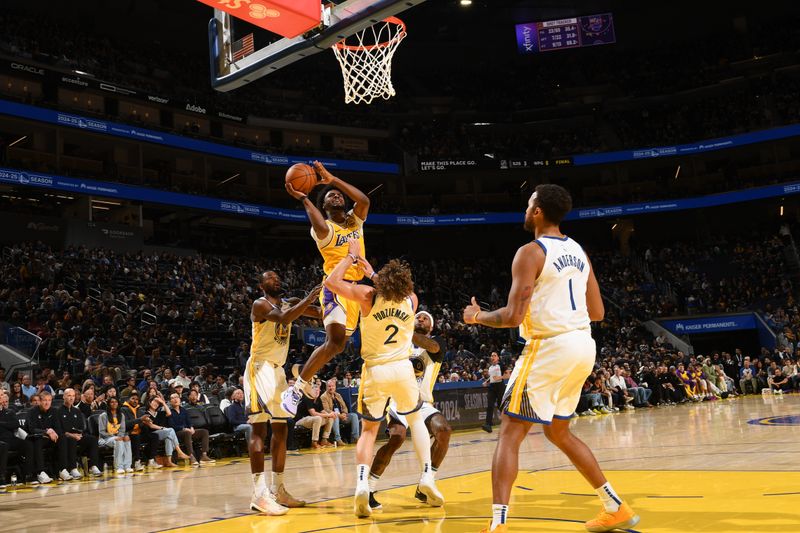 SAN FRANCISCO, CA - OCTOBER 18: Bronny James #9 of the Los Angeles Lakers drives to the basket during the game against the Golden State Warriors during a NBA Preseason game on October 18, 2024 at Chase Center in San Francisco, California. NOTE TO USER: User expressly acknowledges and agrees that, by downloading and or using this photograph, user is consenting to the terms and conditions of Getty Images License Agreement. Mandatory Copyright Notice: Copyright 2024 NBAE (Photo by Noah Graham/NBAE via Getty Images)