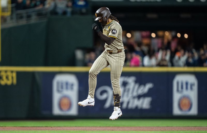 Sep 11, 2024; Seattle, Washington, USA;  San Diego Padres right fielder Fernando Tatis Jr. (23) celebrates while rounding the bases after hitting a solo home run during the seventh inning against the Seattle Mariners at T-Mobile Park. Mandatory Credit: Stephen Brashear-Imagn Images