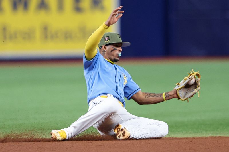 May 21, 2023; St. Petersburg, Florida, USA;  Tampa Bay Rays shortstop Wander Franco (5) fields the ball for an out against the Milwaukee Brewers in the seventh inning at Tropicana Field. Mandatory Credit: Nathan Ray Seebeck-USA TODAY Sports