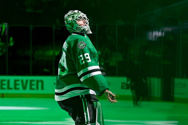 Jan 16, 2024; Dallas, Texas, USA; Dallas Stars center Roope Hintz (24) throws a puck to the fans after he is named the number one star in the Stars victory over the Los Angeles Kings at the American Airlines Center. Mandatory Credit: Jerome Miron-USA TODAY Sports