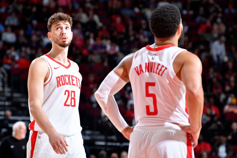 HOUSTON, TX - OCTOBER 17: Alperen Sengun #28 and Fred VanVleet #5 of the Houston Rockets look on during the game against the San Antonio Spurs on October 17, 2024 at the Toyota Center in Houston, Texas. NOTE TO USER: User expressly acknowledges and agrees that, by downloading and or using this photograph, User is consenting to the terms and conditions of the Getty Images License Agreement. Mandatory Copyright Notice: Copyright 2024 NBAE (Photo by Logan Riely/NBAE via Getty Images)