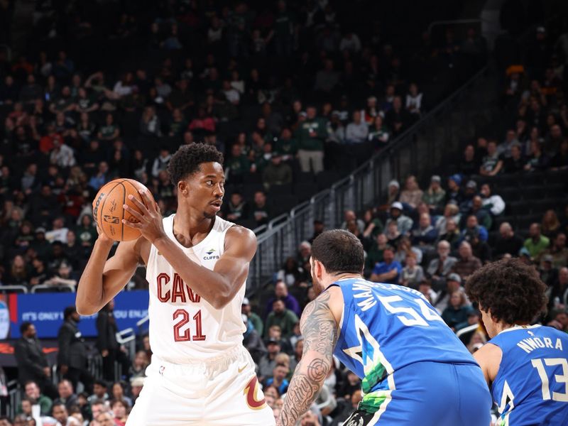 MILWAUKEE, WI - NOVEMBER 16: Mamadi Diakite #21 of the Cleveland Cavaliers handles the ball during the game against the Milwaukee Bucks on November 16, 2022 at the Fiserv Forum Center in Milwaukee, Wisconsin. NOTE TO USER: User expressly acknowledges and agrees that, by downloading and or using this Photograph, user is consenting to the terms and conditions of the Getty Images License Agreement. Mandatory Copyright Notice: Copyright 2022 NBAE (Photo by Jeff Haynes/NBAE via Getty Images).