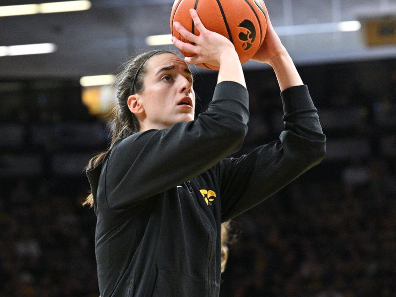 Mar 3, 2024; Iowa City, Iowa, USA; Iowa Hawkeyes guard Caitlin Clark (22) warms up before the game against the Ohio State Buckeyes at Carver-Hawkeye Arena. Clark is attempting to break the NCAA basketball all-time scoring record. Mandatory Credit: Jeffrey Becker-USA TODAY Sports