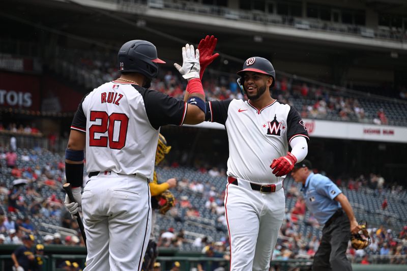 Aug 4, 2024; Washington, District of Columbia, USA; Washington Nationals second baseman Luis Garcia Jr. (2) celebrates at home plate with catcher Keibert Ruiz (20) after hitting a home run against the Milwaukee Brewers during the first inning at Nationals Park. Mandatory Credit: Rafael Suanes-USA TODAY Sports