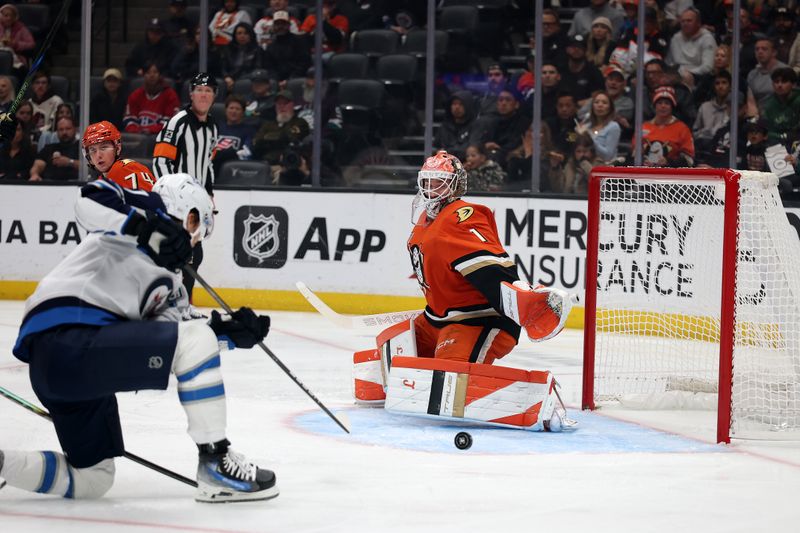 Nov 9, 2025; Anaheim, California, USA;  Anaheim Ducks goaltender Lukas Dostal (1) protects the goal during the first period against the Winnipeg Jets at Honda Center. Mandatory Credit: Kiyoshi Mio-Imagn Images