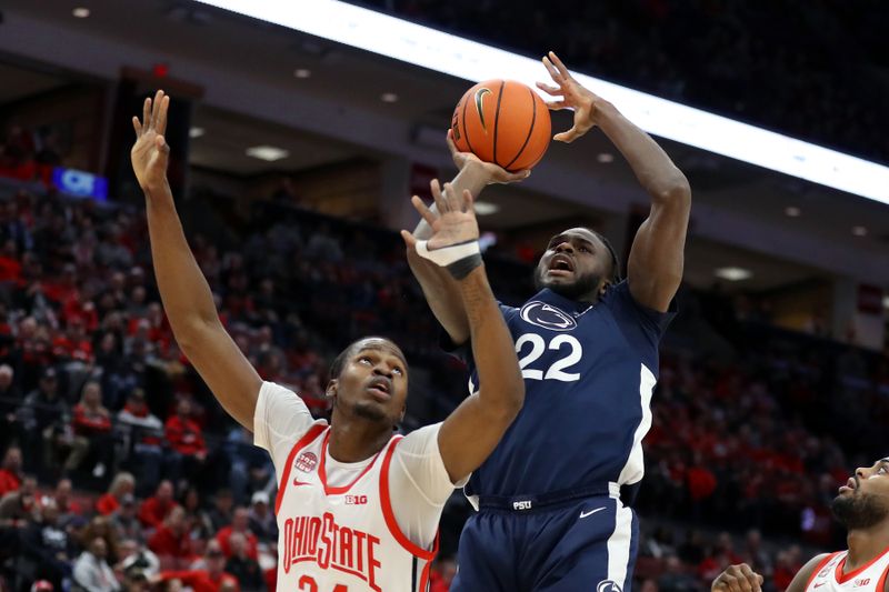 Jan 20, 2024; Columbus, Ohio, USA;  Penn State Nittany Lions forward Qudus Wahab (22) shoots the basketball as Ohio State Buckeyes center Felix Okpara (34) defends during the first half at Value City Arena. Mandatory Credit: Joseph Maiorana-USA TODAY Sports