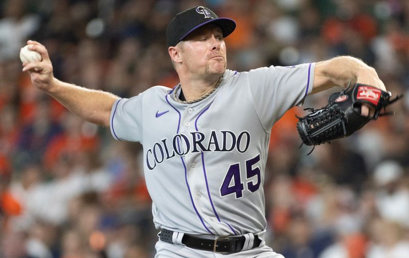 Jul 5, 2023; Houston, Texas, USA; Colorado Rockies starting pitcher Chase Anderson (45) pitches against the Houston Astros in the first inning at Minute Maid Park. Mandatory Credit: Thomas Shea-USA TODAY Sports