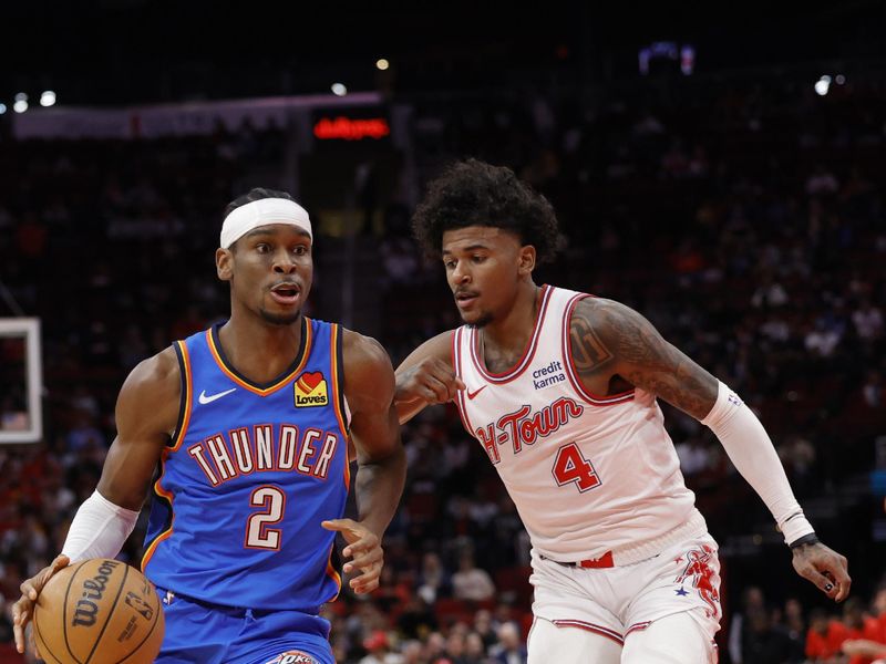 HOUSTON, TEXAS - DECEMBER 06: Shai Gilgeous-Alexander #2 of the Oklahoma City Thunder drives against Jalen Green #4 of the Houston Rockets during the first half at Toyota Center on December 06, 2023 in Houston, Texas. (Photo by Carmen Mandato/Getty Images)