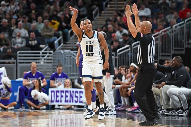 Mar 22, 2024; Indianapolis, IN, USA; Utah State Aggies guard Darius Brown II (10) reacts after a play during the first half the first round of the 2024 NCAA Tournament at Gainbridge FieldHouse. Mandatory Credit: Robert Goddin-USA TODAY Sports