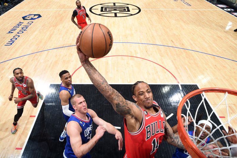 LOS ANGELES, CA - MARCH 27: DeMar DeRozan #11 of the Chicago Bulls drives to the basket during the game against the Chicago Bulls on March 27, 2023 at Crypto.Com Arena in Los Angeles, California. NOTE TO USER: User expressly acknowledges and agrees that, by downloading and/or using this Photograph, user is consenting to the terms and conditions of the Getty Images License Agreement. Mandatory Copyright Notice: Copyright 2023 NBAE (Photo by Adam Pantozzi/NBAE via Getty Images)