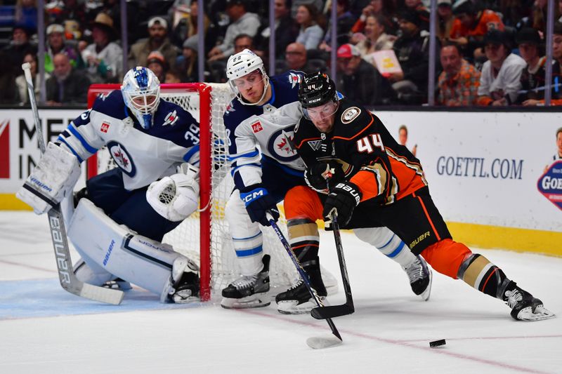 Jan 5, 2024; Anaheim, California, USA; Winnipeg Jets defenseman Nate Schmidt (88) helps goaltender Laurent Brossoit (39) defend the goal agianst Anaheim Ducks left wing Ross Johnston (44) during the second period at Honda Center. Mandatory Credit: Gary A. Vasquez-USA TODAY Sports