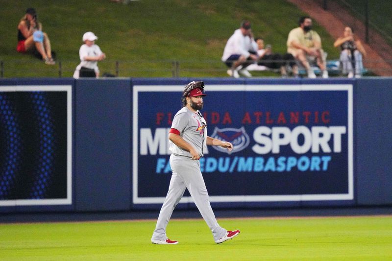 Mar 8, 2024; West Palm Beach, Florida, USA:  St. Louis Cardinals starting pitcher Lance Lynn (31) takes his time leaving the ballpark after getting thrown out of the game by umpire Angel Hernandez (5) in the third inning at CACTI Park of the Palm Beaches. Mandatory Credit: Jim Rassol-USA TODAY Sports