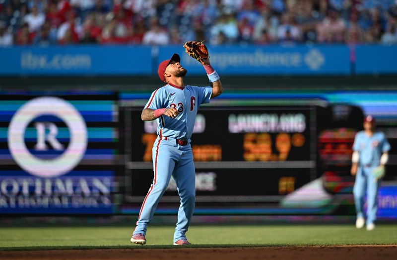 Jun 27, 2024; Philadelphia, Pennsylvania, USA; Philadelphia Phillies infielder Edmundo Sosa (33) fields a fly ball against the Miami Marlins in the second inning at Citizens Bank Park. Mandatory Credit: Kyle Ross-USA TODAY Sports