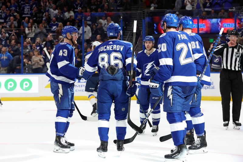 Dec 19, 2023; Tampa, Florida, USA; Tampa Bay Lightning right wing Nikita Kucherov (86) is congratulated after scoring during the first period against the St. Louis Blues at Amalie Arena. Mandatory Credit: Kim Klement Neitzel-USA TODAY Sports