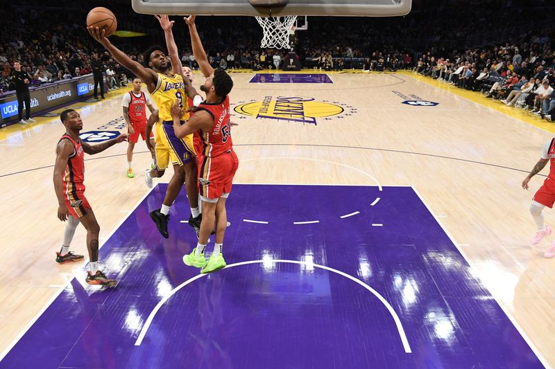 LOS ANGELES, CA - MARCH 4: Bronny James #9 of the Los Angeles Lakers drives to the basket during the game against the New Orleans Pelicans on March 4, 2025 at Crypto.Com Arena in Los Angeles, California. NOTE TO USER: User expressly acknowledges and agrees that, by downloading and/or using this Photograph, user is consenting to the terms and conditions of the Getty Images License Agreement. Mandatory Copyright Notice: Copyright 2025 NBAE (Photo by Juan Ocampo/NBAE via Getty Images)