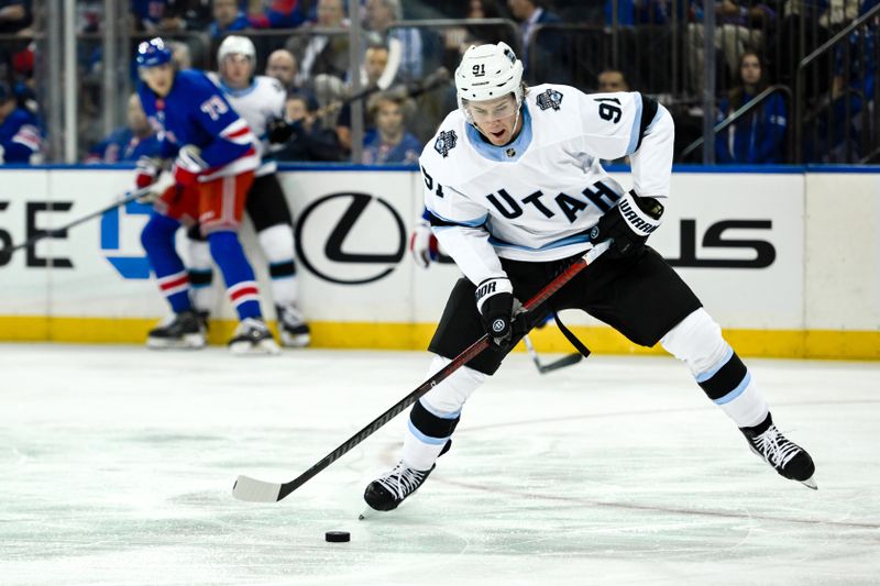 Oct 12, 2024; New York, New York, USA; Utah Hockey Club right wing Josh Doan (91) prepares to take a shot against the New York Rangers during the third period at Madison Square Garden. Mandatory Credit: John Jones-Imagn Images