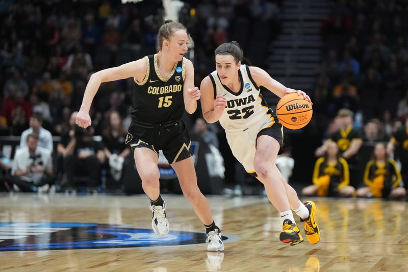 Mar 24, 2023; Seattle, WA, USA; Iowa Hawkeyes guard Caitlin Clark (22) dribbles the ball against Colorado Buffaloes guard Kindyll Wetta (15) in the first half at Climate Pledge Arena. Mandatory Credit: Kirby Lee-USA TODAY Sports