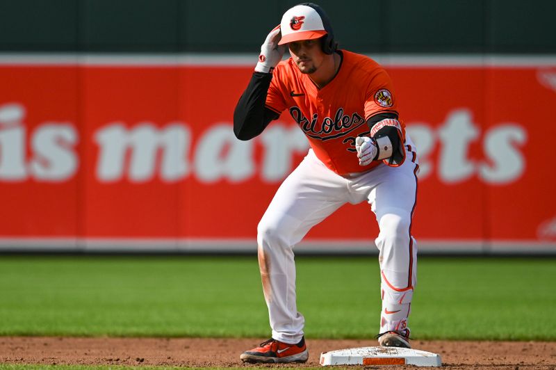 Aug 24, 2024; Baltimore, Maryland, USA;  Baltimore Orioles catcher Adley Rutschman (35) reacts after hitting a third inning double against the Houston Astros at Oriole Park at Camden Yards. Mandatory Credit: Tommy Gilligan-USA TODAY Sports