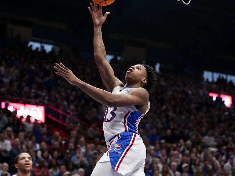 Jan 6, 2024; Lawrence, Kansas, USA; Kansas Jayhawks guard Elmarko Jackson (13) shoots during the second half against the TCU Horned Frogs at Allen Fieldhouse. Mandatory Credit: Jay Biggerstaff-USA TODAY Sports