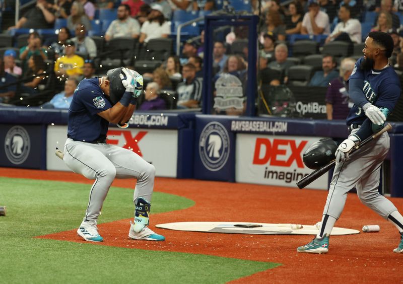 Sep 8, 2023; St. Petersburg, Florida, USA; Seattle Mariners center fielder Julio Rodriguez (44) celebrates with right fielder Teoscar Hernandez (35) after he hits a home run against the Tampa Bay Rays during the third inning at Tropicana Field. Mandatory Credit: Kim Klement Neitzel-USA TODAY Sports