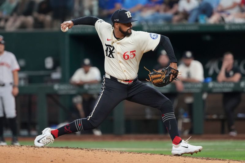 Jun 7, 2024; Arlington, Texas, USA; Texas Rangers relief pitcher Grant Anderson (65) delivers a pitch to the San Francisco Giants during the seventh inning at Globe Life Field. Mandatory Credit: Jim Cowsert-USA TODAY Sports