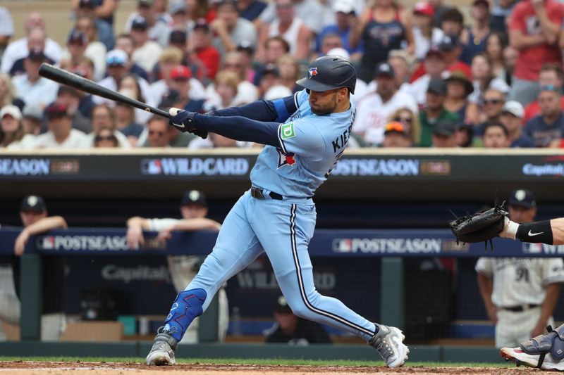 Oct 3, 2023; Minneapolis, Minnesota, USA; Toronto Blue Jays center fielder Kevin Kiermaier (39) hits RBI single in the sixth inning against the Minnesota Twins during game one of the Wildcard series for the 2023 MLB playoffs at Target Field. Mandatory Credit: Jesse Johnson-USA TODAY Sports