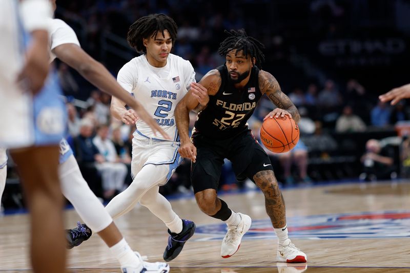 Mar 14, 2024; Washington, D.C., USA; Florida State guard Darin Green Jr. (22) drives to the basket as North Carolina guard Elliot Cadeau (2) defends in the first half at Capital One Arena. Mandatory Credit: Geoff Burke-USA TODAY Sports