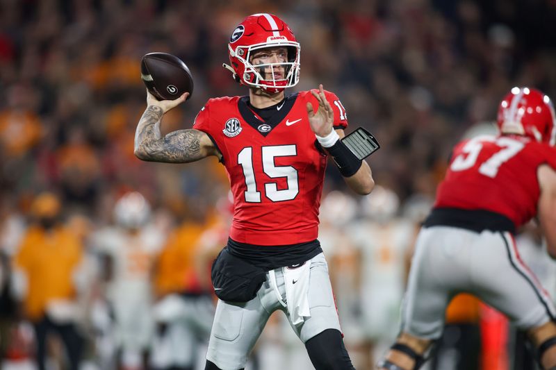Nov 16, 2024; Athens, Georgia, USA; Georgia Bulldogs quarterback Carson Beck (15) throws a pass against the Tennessee Volunteers in the first quarter at Sanford Stadium. Mandatory Credit: Brett Davis-Imagn Images
