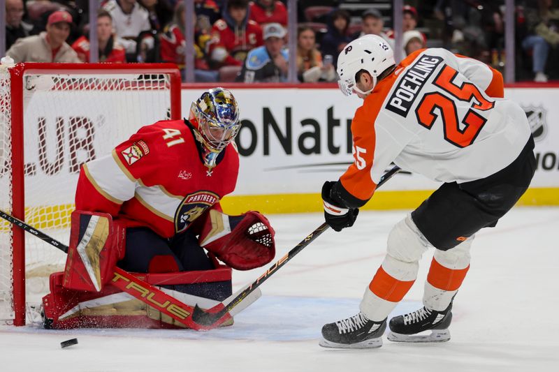 Feb 6, 2024; Sunrise, Florida, USA; Florida Panthers goaltender Anthony Stolarz (41) makes a save against Philadelphia Flyers center Ryan Poehling (25) during the third period at Amerant Bank Arena. Mandatory Credit: Sam Navarro-USA TODAY Sports