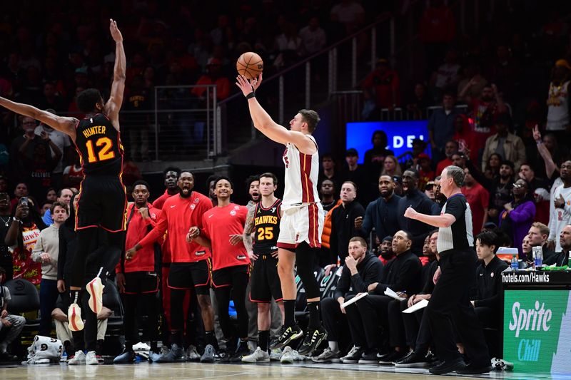 ATLANTA, GA - APRIL 9: Nikola Jovic #5 of the Miami Heat shoots the ball during the game against the Atlanta Hawks on April 9, 2024 at State Farm Arena in Atlanta, Georgia.  NOTE TO USER: User expressly acknowledges and agrees that, by downloading and/or using this Photograph, user is consenting to the terms and conditions of the Getty Images License Agreement. Mandatory Copyright Notice: Copyright 2024 NBAE (Photo by Scott Cunningham/NBAE via Getty Images)