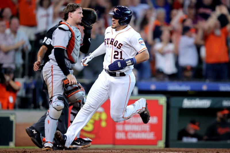 Sep 20, 2023; Houston, Texas, USA; Houston Astros catcher Yainer Diaz (21) crosses home plate to score the winning run against the Baltimore Orioles during the ninth inning at Minute Maid Park. Mandatory Credit: Erik Williams-USA TODAY Sports