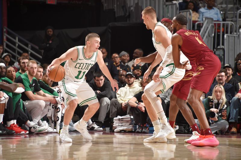 CLEVELAND, OH - DECEMBER 1: Payton Pritchard #11 of the Boston Celtics dribbles the ball during the game against the Cleveland Cavaliers on December 1, 2024 at Rocket Mortgage FieldHouse in Cleveland, Ohio. NOTE TO USER: User expressly acknowledges and agrees that, by downloading and/or using this Photograph, user is consenting to the terms and conditions of the Getty Images License Agreement. Mandatory Copyright Notice: Copyright 2024 NBAE (Photo by David Liam Kyle/NBAE via Getty Images)