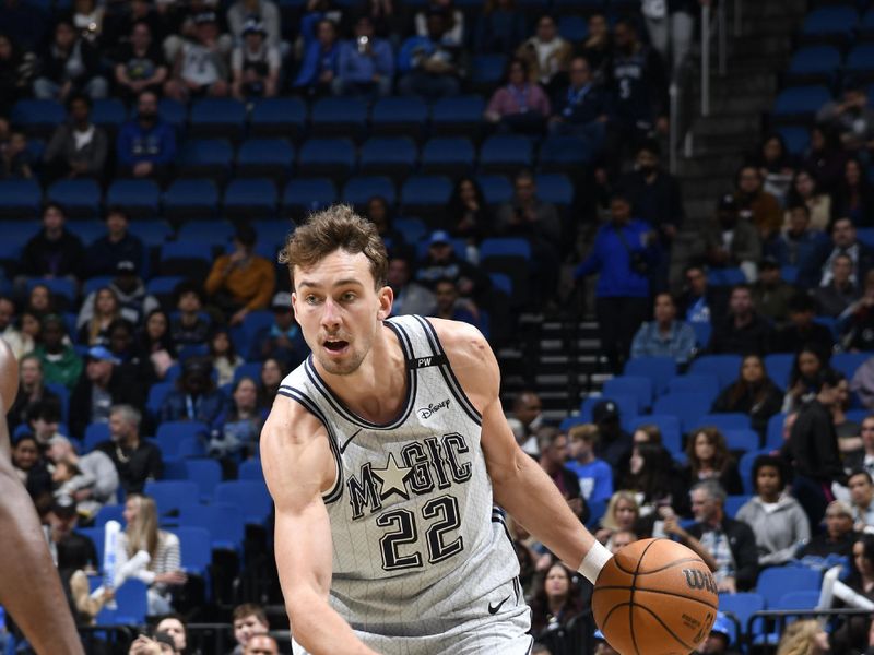 ORLANDO, FL - NOVEMBER 23: Franz Wagner #22 of the Orlando Magic drives to the basket during the game against the Detroit Pistons on November 23, 2024 at Kia Center in Orlando, Florida. NOTE TO USER: User expressly acknowledges and agrees that, by downloading and or using this photograph, User is consenting to the terms and conditions of the Getty Images License Agreement. Mandatory Copyright Notice: Copyright 2024 NBAE (Photo by Fernando Medina/NBAE via Getty Images)