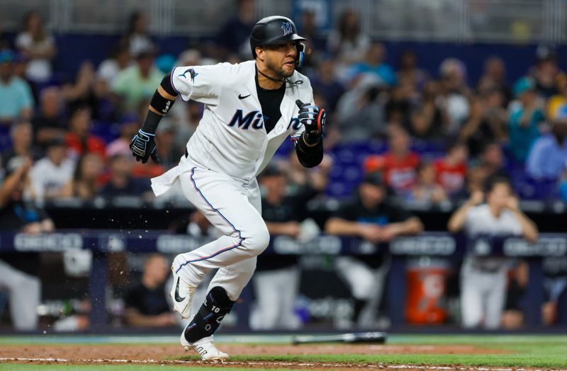 Jun 25, 2023; Miami, Florida, USA; Miami Marlins first baseman Yuli Gurriel (10) runs toward first base after hitting an RBI single against the Pittsburgh Pirates during the eighth inning at loanDepot Park. Mandatory Credit: Sam Navarro-USA TODAY Sports