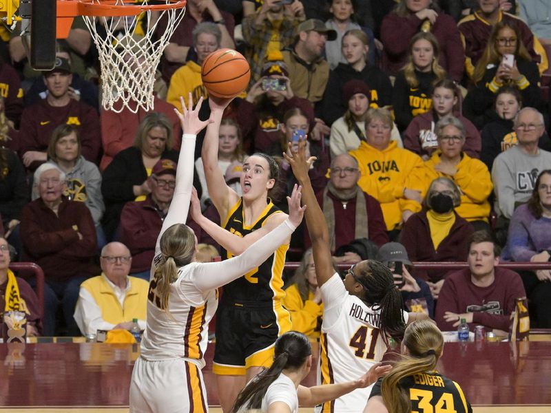 Feb 28, 2024; Minneapolis, Minnesota, USA; Iowa Hawkeyes guard Caitlin Clark (22) hits a floater against the Minnesota Golden Gophers during the fourth quarter at Williams Arena. Mandatory Credit: Nick Wosika-USA TODAY Sports