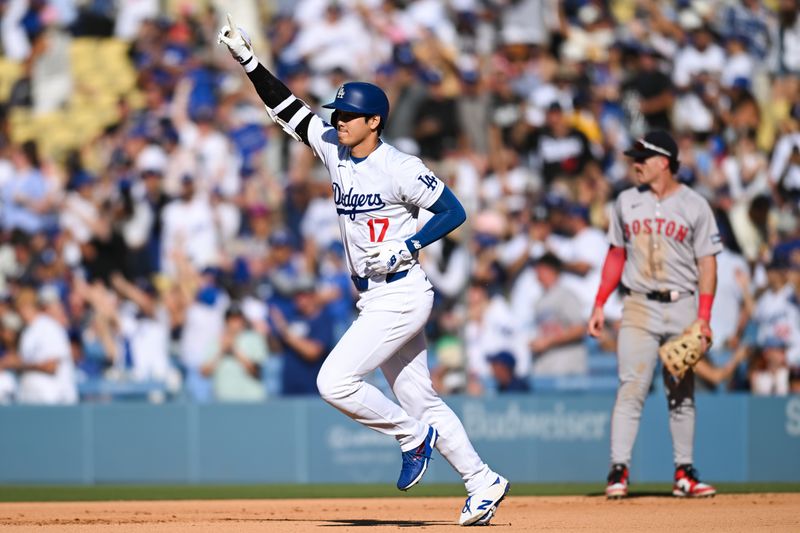 Jul 21, 2024; Los Angeles, California, USA; Los Angeles Dodgers designated hitter Shohei Ohtani (17) celebrates after hitting a solo home run against the Boston Red Sox during the fifth inning at Dodger Stadium. Mandatory Credit: Jonathan Hui-USA TODAY Sports