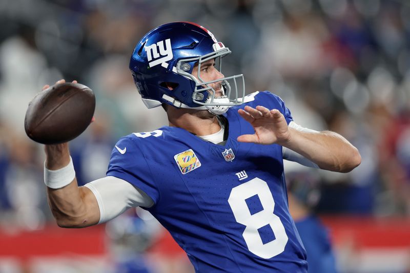 New York Giants quarterback Daniel Jones (8) warms up before playing against the Dallas Cowboys in an NFL football game, Thursday, Sept. 26, 2024, in East Rutherford, N.J. (AP Photo/Adam Hunger)
