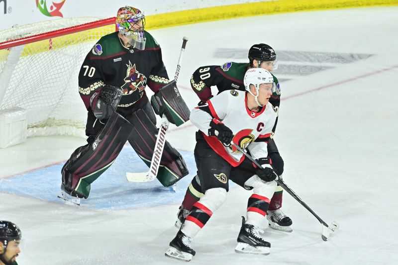 Dec 19, 2023; Tempe, Arizona, USA; Arizona Coyotes defenseman J.J. Moser (90) and Ottawa Senators left wing Brady Tkachuk (7) battle for osition in front pf goaltender Karel Vejmelka (70) in the third period at Mullett Arena. Mandatory Credit: Matt Kartozian-USA TODAY Sports