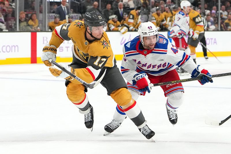 Nov 18, 2025; Las Vegas, Nevada, USA; Vegas Golden Knights defenseman Ben Hutton (17) skates against New York Rangers left wing Conor Sheary (43) during the second period at T-Mobile Arena. Mandatory Credit: Stephen R. Sylvanie-Imagn Images