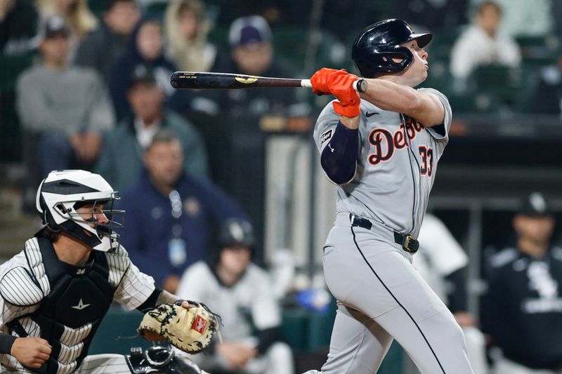 Jun 4, 2025; Chicago, Illinois, USA; Detroit Tigers designated hitter Colt Keith (33) hits an RBI-single against the Chicago White Sox during the eight inning at Rate Field. Mandatory Credit: Kamil Krzaczynski-Imagn Images