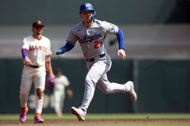 Sep 14, 2025; San Francisco, California, USA; Los Angeles Dodgers center fielder Tommy Edman (25) advances from second to third on a wild pitch by San Francisco Giants starting pitcher Robbie Ray during the second inning at Oracle Park. Mandatory Credit: D. Ross Cameron-Imagn Images