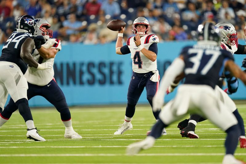 New England Patriots quarterback Bailey Zappe (4) passes in the first half of an NFL preseason football game against the Tennessee Titans Friday, Aug. 25, 2023, in Nashville, Tenn. (AP Photo/George Walker IV)