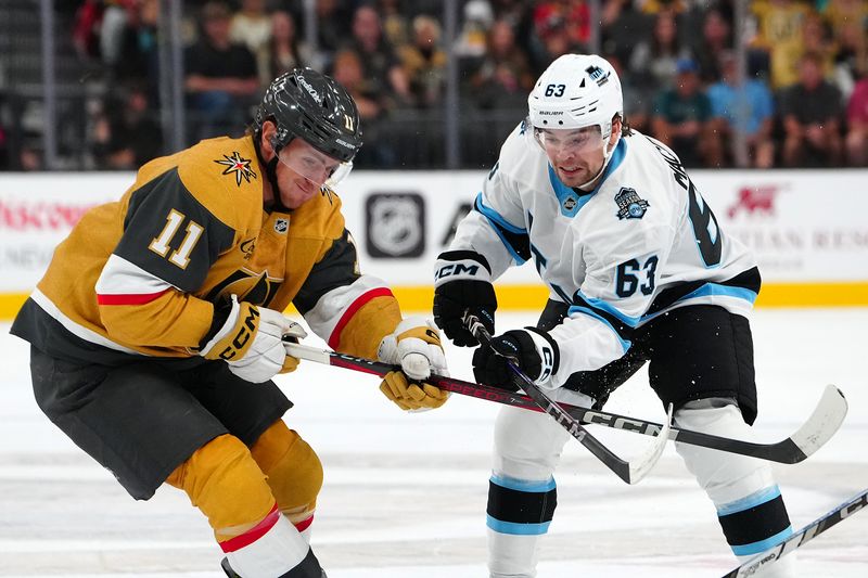 Sep 27, 2024; Las Vegas, Nevada, USA; Vegas Golden Knights left wing Mason Morelli (11) lifts the stick of Utah Hockey Club forward Matias Maccelli (63) during the third period at T-Mobile Arena. Mandatory Credit: Stephen R. Sylvanie-Imagn Images