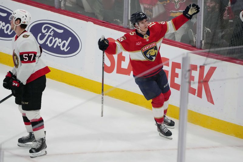 Feb 20, 2024; Sunrise, Florida, USA; Florida Panthers center Anton Lundell (15) celebrates the winning goal in overtime against the Ottawa Senators at Amerant Bank Arena. Mandatory Credit: Jim Rassol-USA TODAY Sports