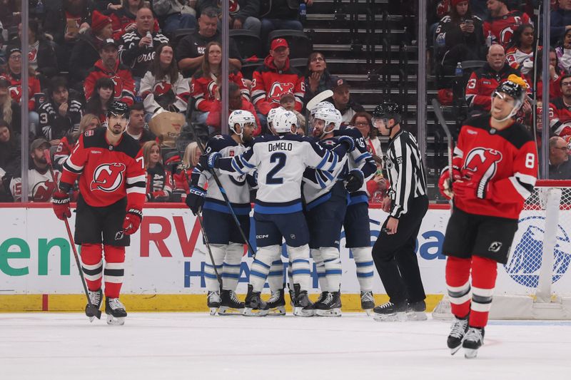 Jan 27, 2026; Newark, New Jersey, USA; Winnipeg Jets left wing Cole Koepke (45) celebrates his goal against the New Jersey Devils during the second period at Prudential Center. Mandatory Credit: Ed Mulholland-Imagn Images