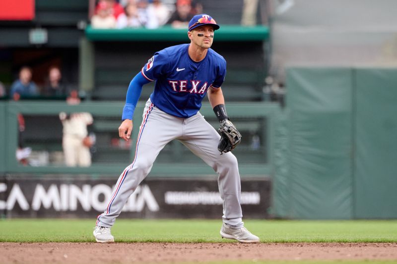Apr 27, 2025; San Francisco, California, USA; Texas Rangers shortstop Nick Ahmed (23) during the fifth inning against the San Francisco Giants at Oracle Park. Mandatory Credit: Robert Edwards-Imagn Images Apr 27, 2025; San Francisco, California, USA; Texas Rangers shortstop Nick Ahmed (23) during the fifth inning against the San Francisco Giants at Oracle Park. Mandatory Credit: Robert Edwards-Imagn Images