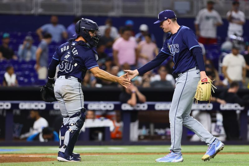 Jun 5, 2024; Miami, Florida, USA; Tampa Bay Rays relief pitcher Pete Fairbanks (29) celebrates with catcher Ben Rortvedt (30) after the game against the Miami Marlins at loanDepot Park. Mandatory Credit: Sam Navarro-USA TODAY Sports