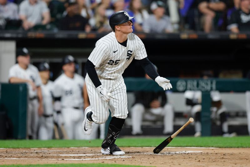 Aug 9, 2024; Chicago, Illinois, USA; Chicago White Sox first baseman Andrew Vaughn (25) watches his solo home run against the Chicago Cubs during the fourth inning at Guaranteed Rate Field. Mandatory Credit: Kamil Krzaczynski-USA TODAY Sports