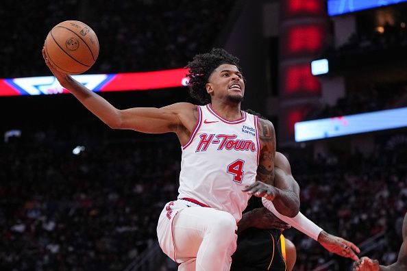 HOUSTON, TEXAS - DECEMBER 27: Jalen Green #4 of the Houston Rockets drives to the basket during the third quarter of the game against the Phoenix Suns at Toyota Center on December 27, 2023 in Houston, Texas. User expressly acknowledges and agrees that, by downloading and or using this photograph, User is consenting to the terms and conditions of the Getty Images License Agreement. (Photo by Alex Bierens de Haan/Getty Images)