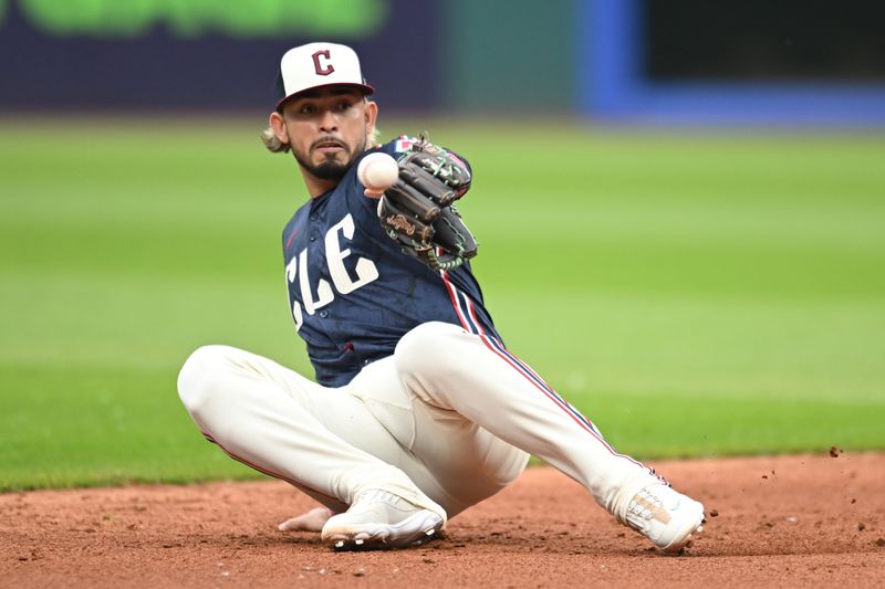 May 30, 2025; Cleveland, Ohio, USA; Cleveland Guardians shortstop Gabriel Arias (13) fails to catch a ball hit by Los Angeles Angels catcher Logan O'Hoppe (not pictured) during the second inning at Progressive Field. Mandatory Credit: Ken Blaze-Imagn Images